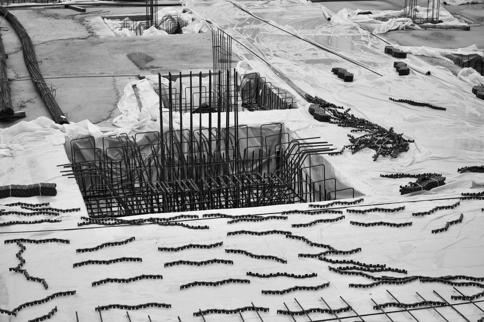 Aerial view of a rebar-reinforced pool shell under construction